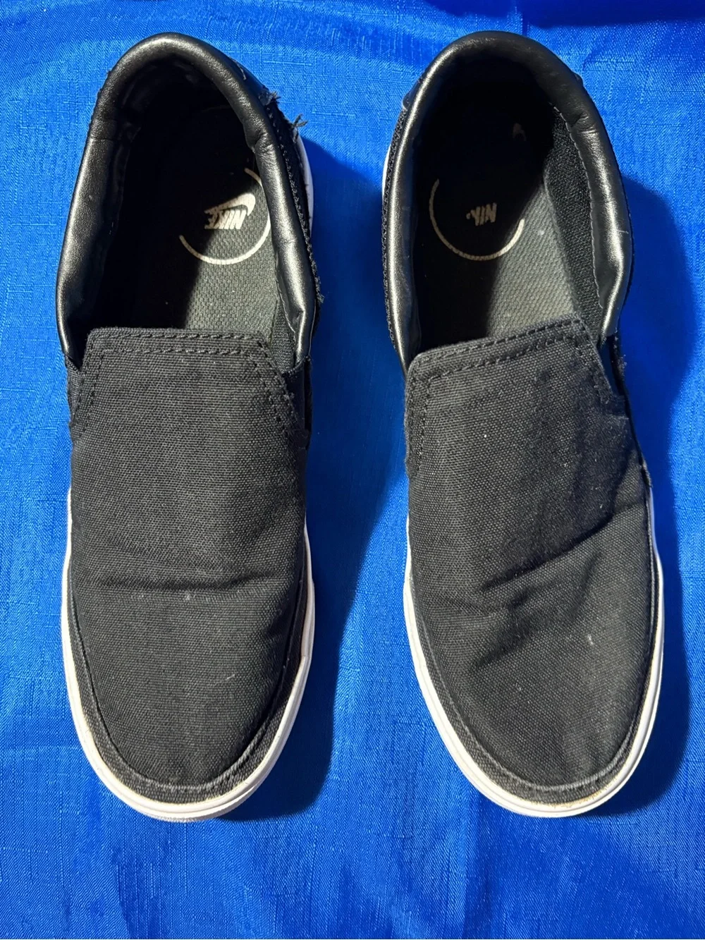 Nike Black Slip-On Canvas Sneakers with White Swoosh